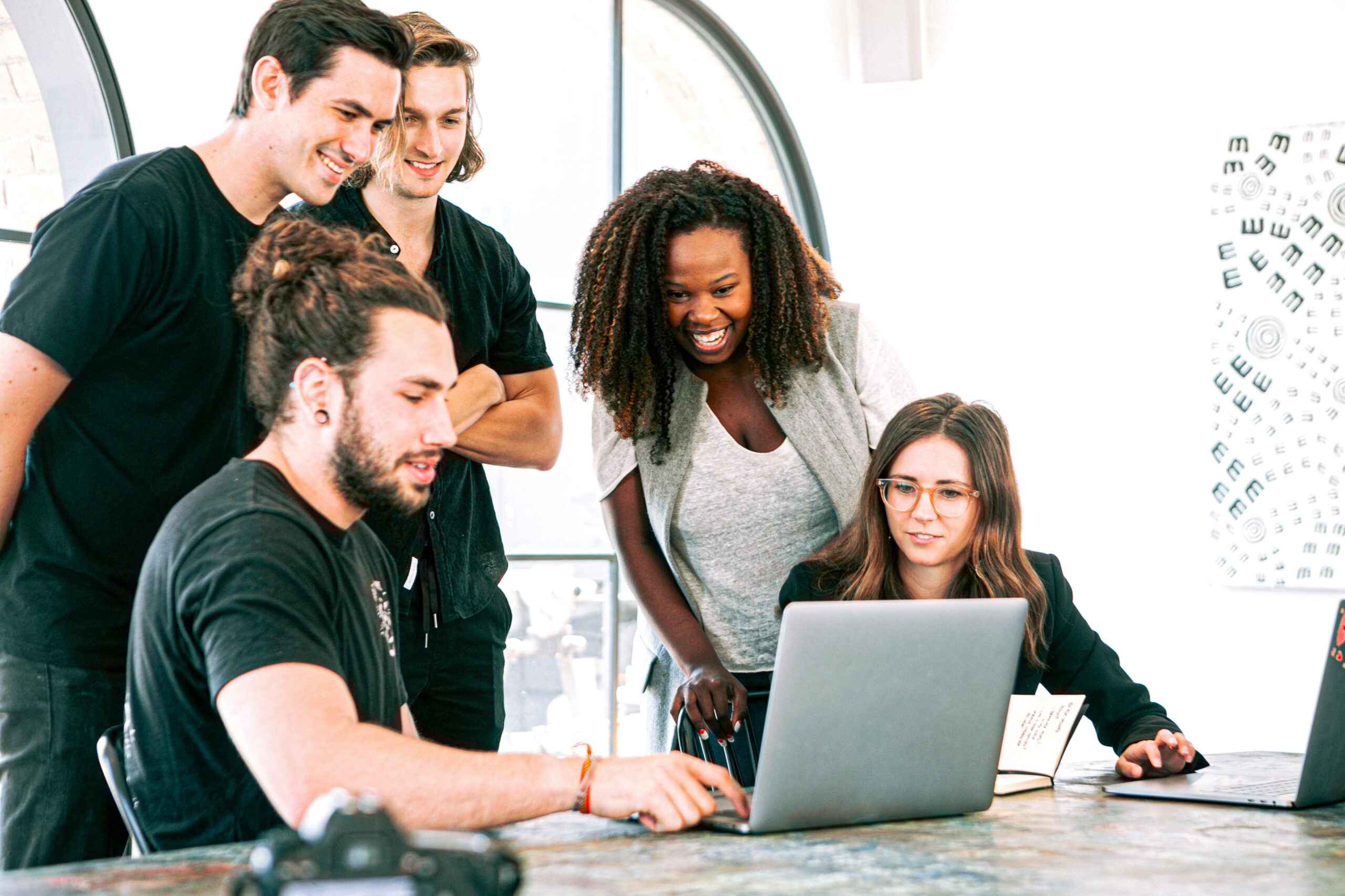 Stock image of a small group of people collaborating on a project.